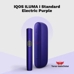 IQOS ILUMA i Electric Purple device resting on a workspace surface in a Dubai showing its deep violet metallic finish